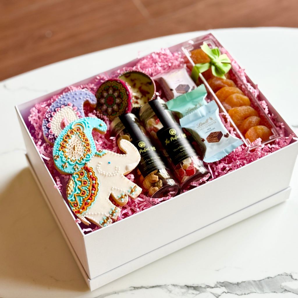 Gift box with stationery items on a marble surface