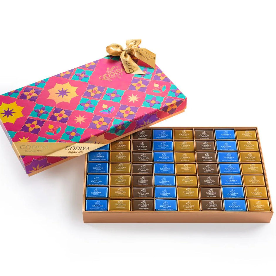 Colorful Godiva chocolate box with a decorative pink drawstring bag on a white background