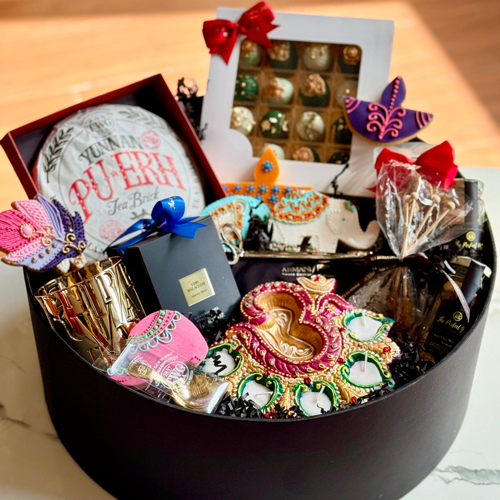 Decorative gift basket with colorful items on a marble surface
