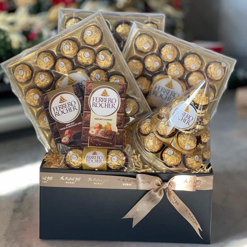 Ferrero Rocher chocolate set in a decorative box with a blurred festive background