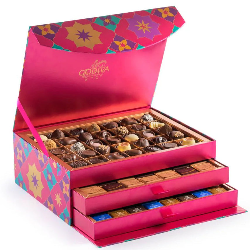 Decorative chocolate box with colorful floral design on a white background