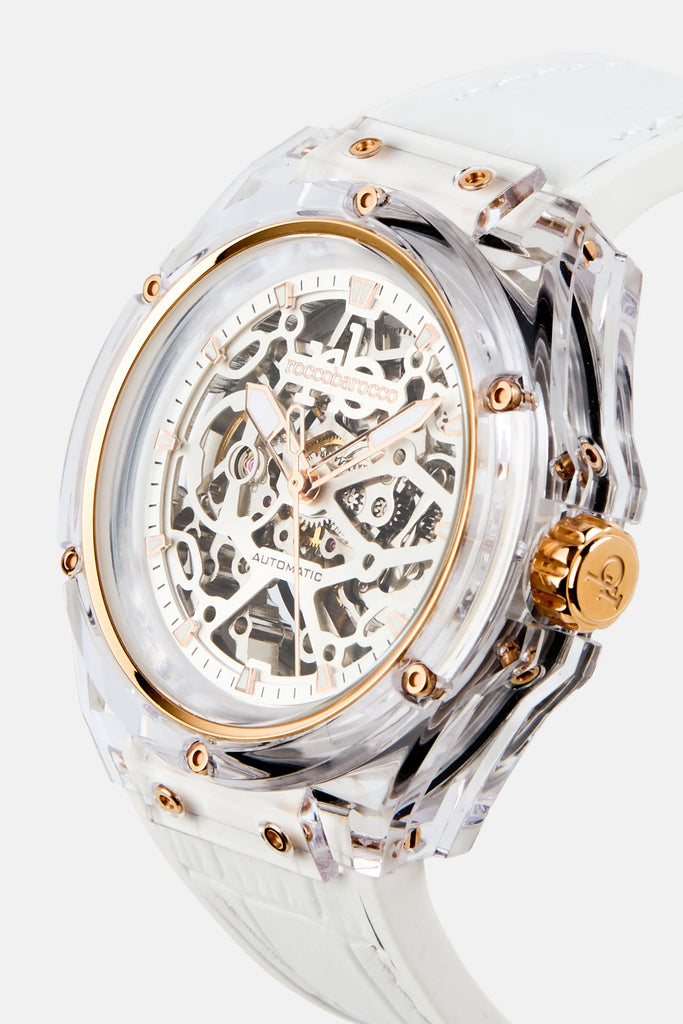 Luxury watch with transparent case and gold accents on a white background