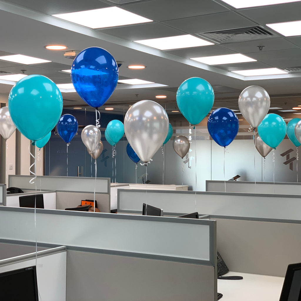 Office cubicles with balloons in a modern office setting