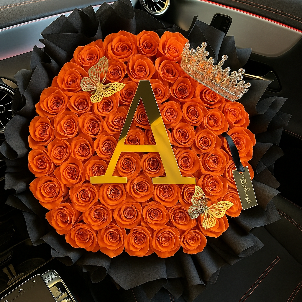 Decorative arrangement of orange roses with a letter 'A', crown, and butterflies on a black background.