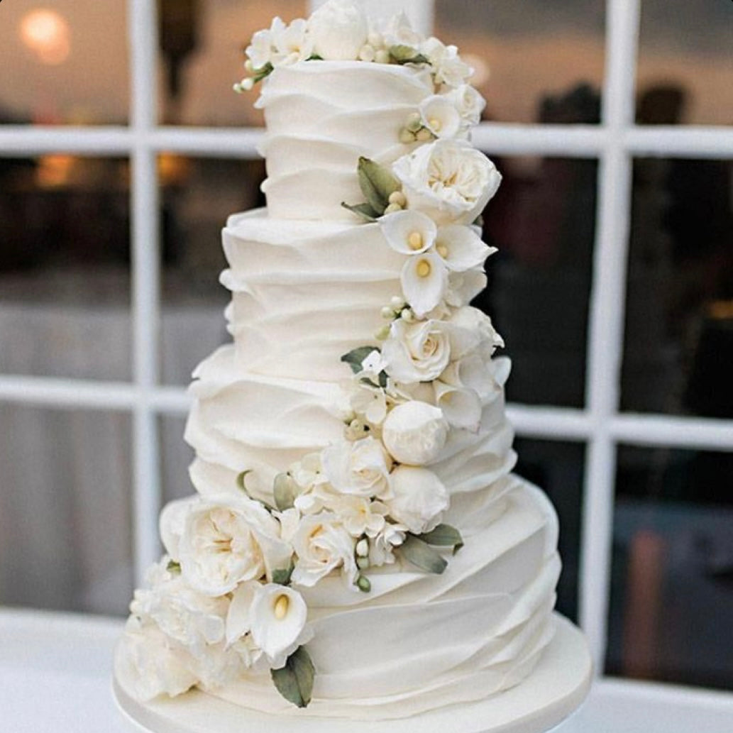white wedding cake with lilies White Lily & Peonies Wedding Cake Dubai - Made with Swiss Ingredients
